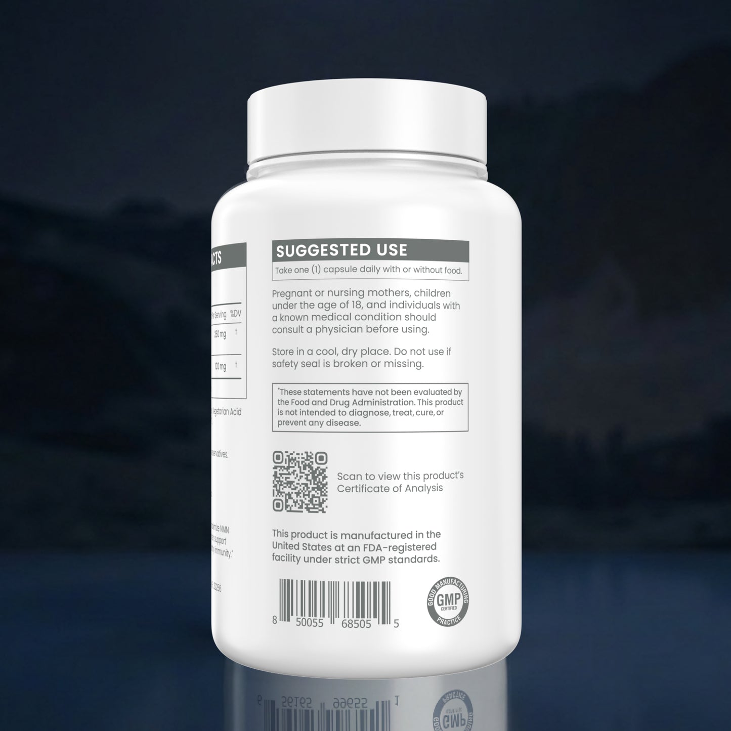 A white plastic supplement bottle shown from the back, featuring a white cap and a white label with black text sections including 'SUGGESTED USE', a QR code, and a GMP seal, set against a dark blue reflective background.