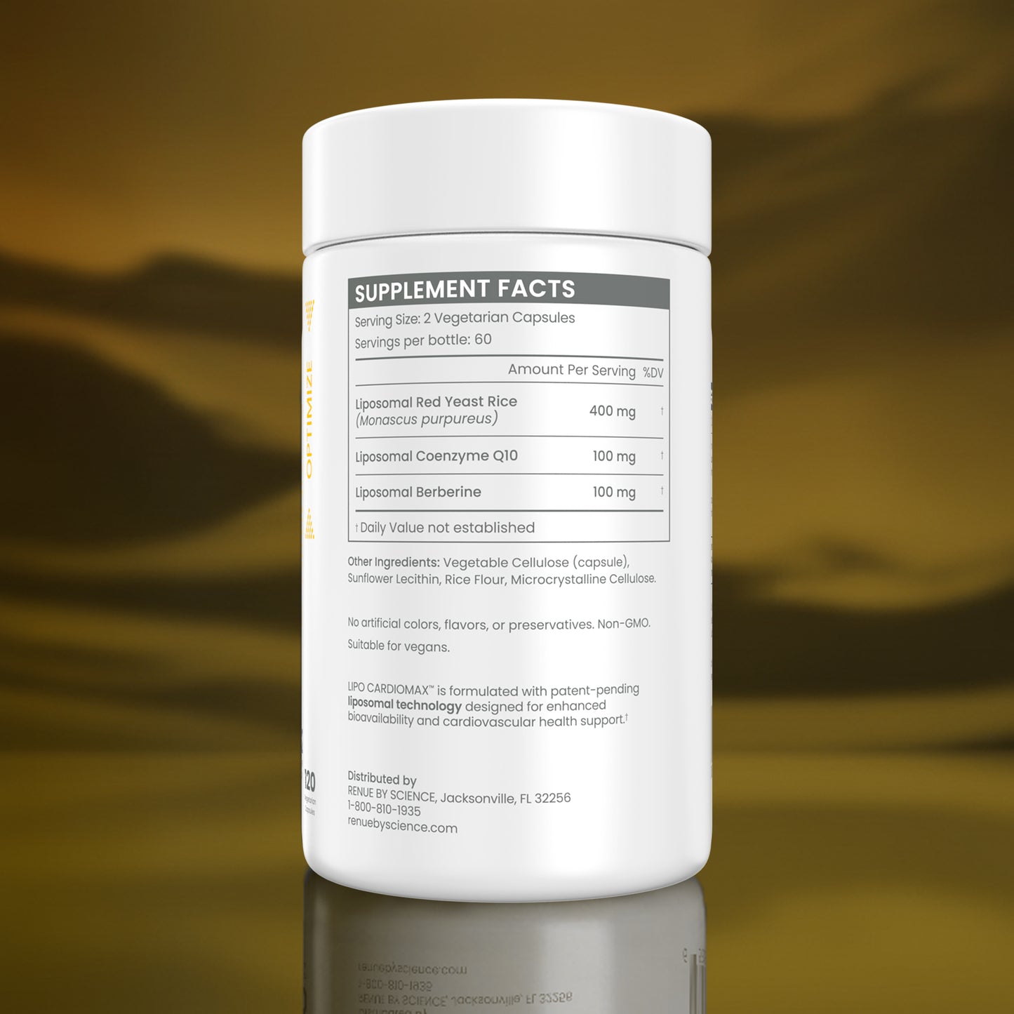 A white supplement bottle shown from the back, featuring a detailed 'Supplement Facts' label with text and a nutrition table. The bottle is set against a reflective, metallic gold background.
