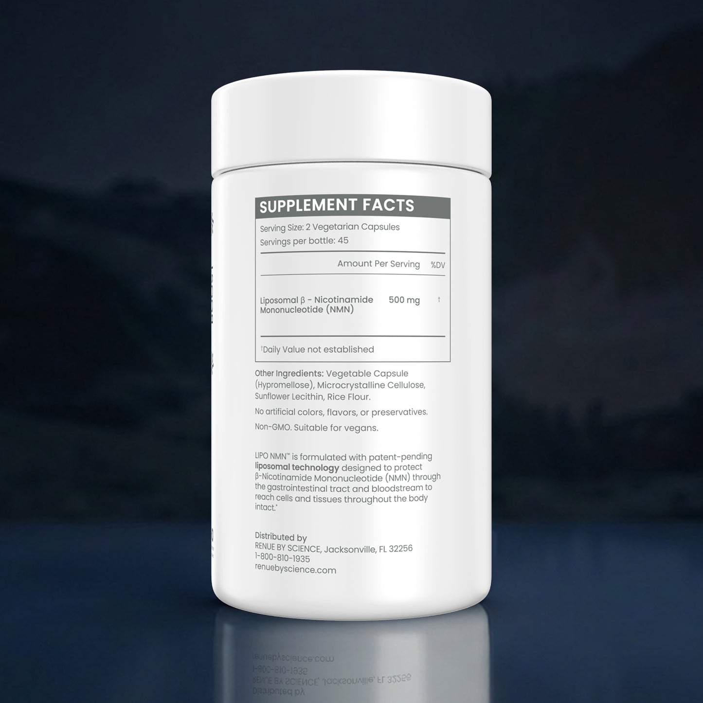 A white plastic bottle of IPC Nutrition IP-MAN+ dietary supplement capsules, showing the supplement facts label, set against a dark blue reflective background.