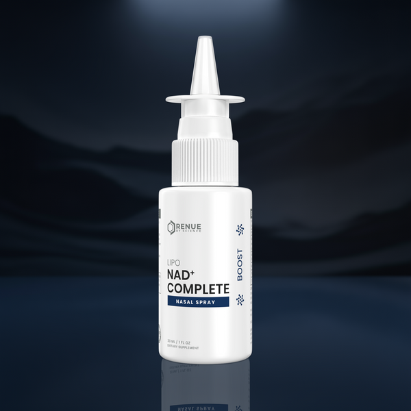 A white bottle of Renue Labs NAD+ Complete Nasal Spray with a pointed applicator nozzle, set against a dark blue, moody background with a subtle reflection below.