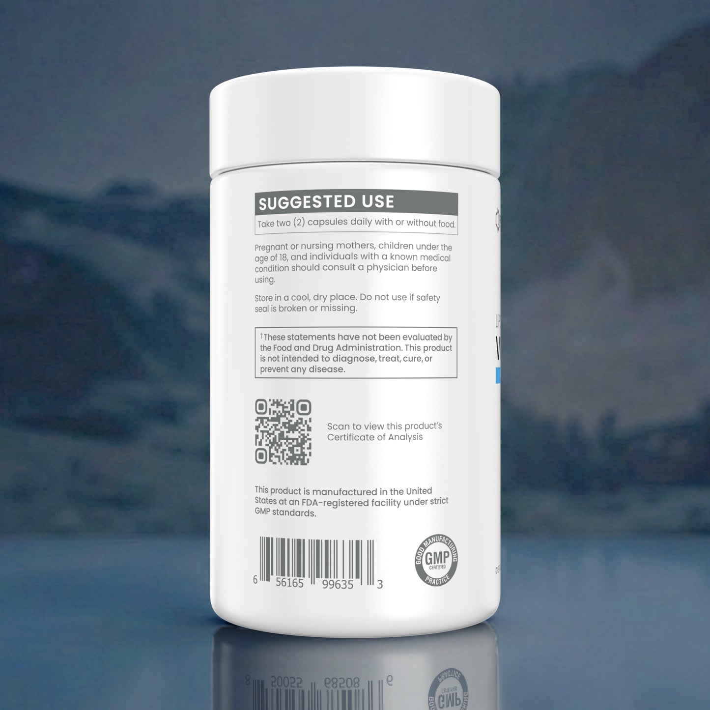 A white plastic bottle of dietary supplement capsules shown from the back, featuring a white label with black text, a QR code, and a GMP seal, set against a blurred blue-toned background.