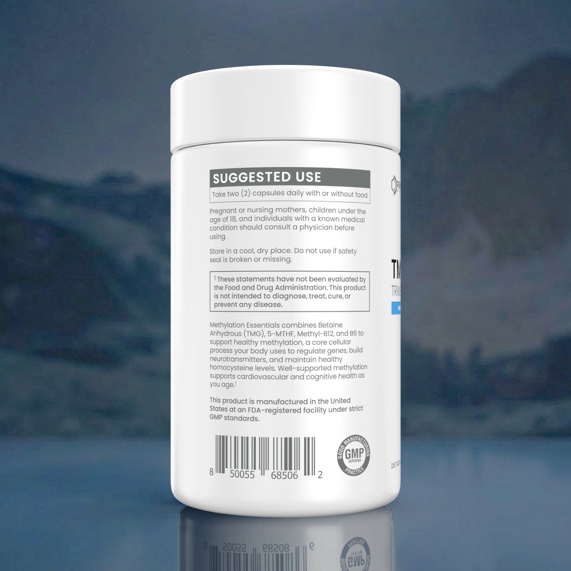 A white plastic bottle of dietary supplements shown from the back, featuring a white cap and a white label with black text, set against a dark blue reflective background.