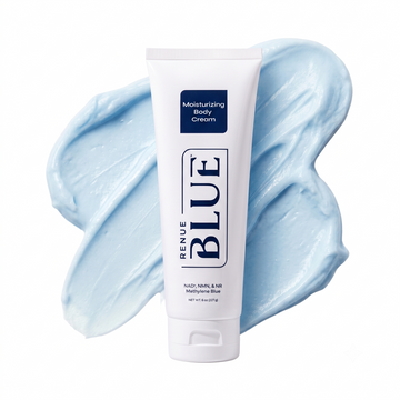A white squeeze tube of Renue Blue Moisturizing Body Cream centered in front of a light blue cream smear on a white background.