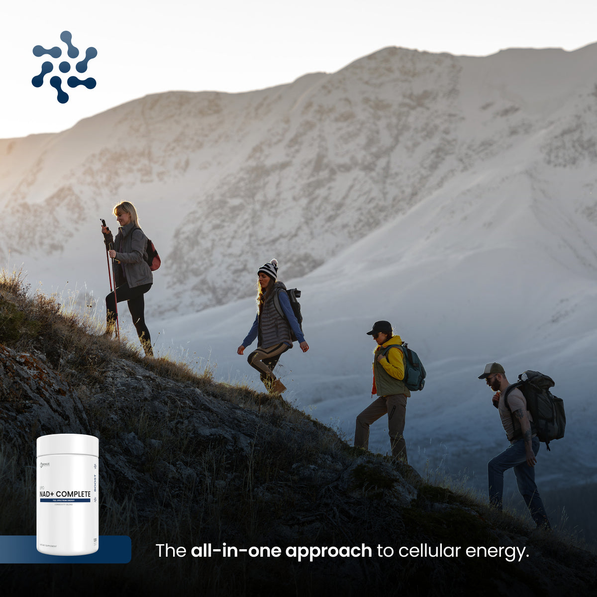 Four hikers ascend a mountain ridge with snow-covered peaks in the background. A white supplement tub labeled HIGH COMPLETE appears in the lower left, with the text 'The all-in-one approach to cellular energy.