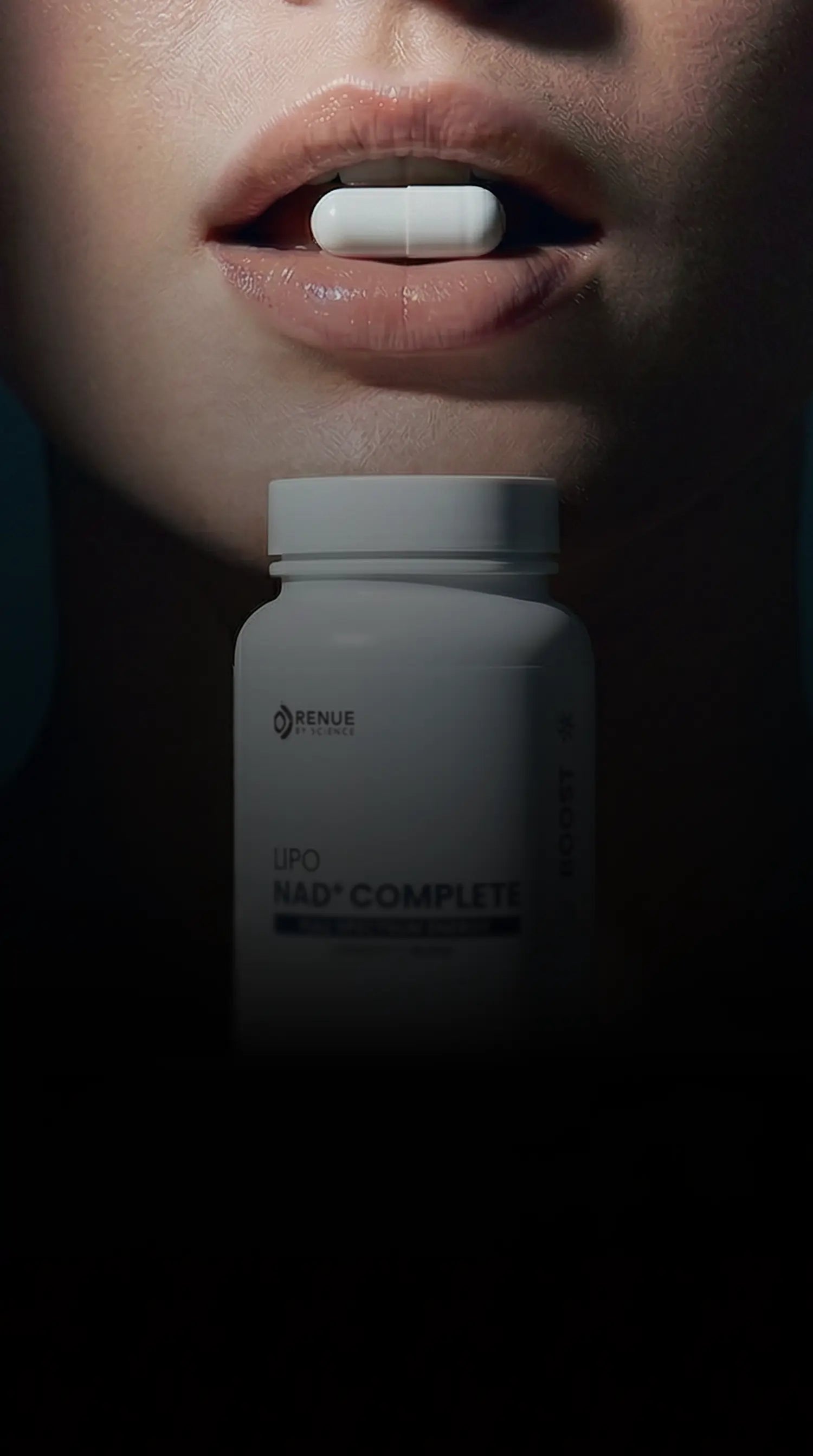 Close-up of a person holding a supplement bottle labeled 'Reneve' with a dark background.