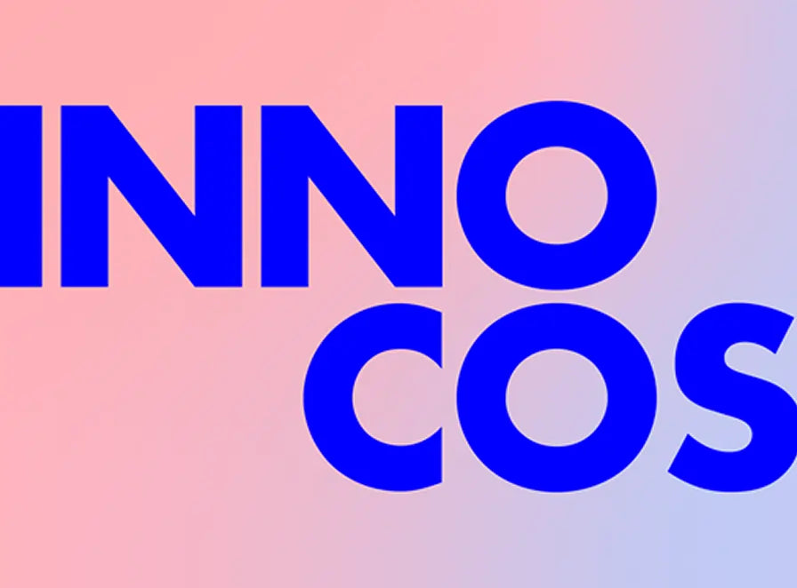 Blue text 'INNOCOS' on a gradient pink to blue background