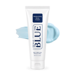 A white squeeze tube of Renue Blue Moisturizing Body Cream with a light blue cream smear behind it on a white background.